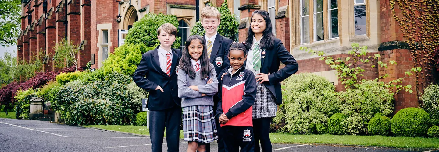 Group of Wolverhampton Grammar School students in front of school